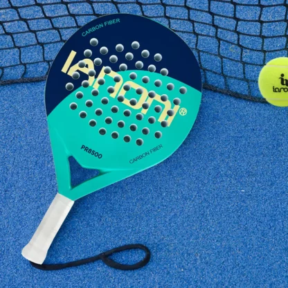 The IANONI PR8500 Padel Racket on the floor of a Padel court with a ball next to it.